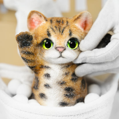 Yellow Tabby Cat handmade squishy toy with green eyes and raised paws, made of soft material.