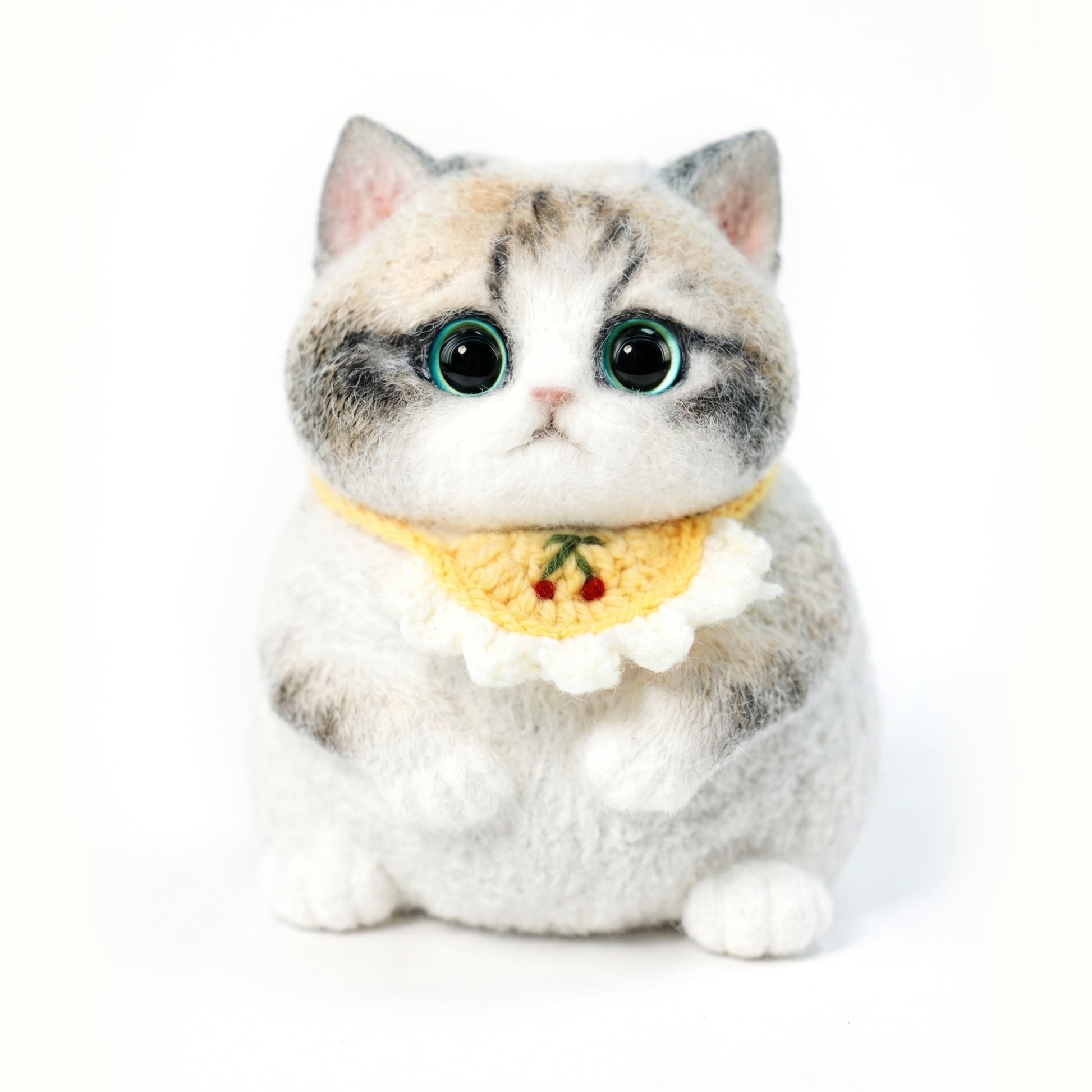 Cute plush ragdoll kitten with big eyes and soft fur